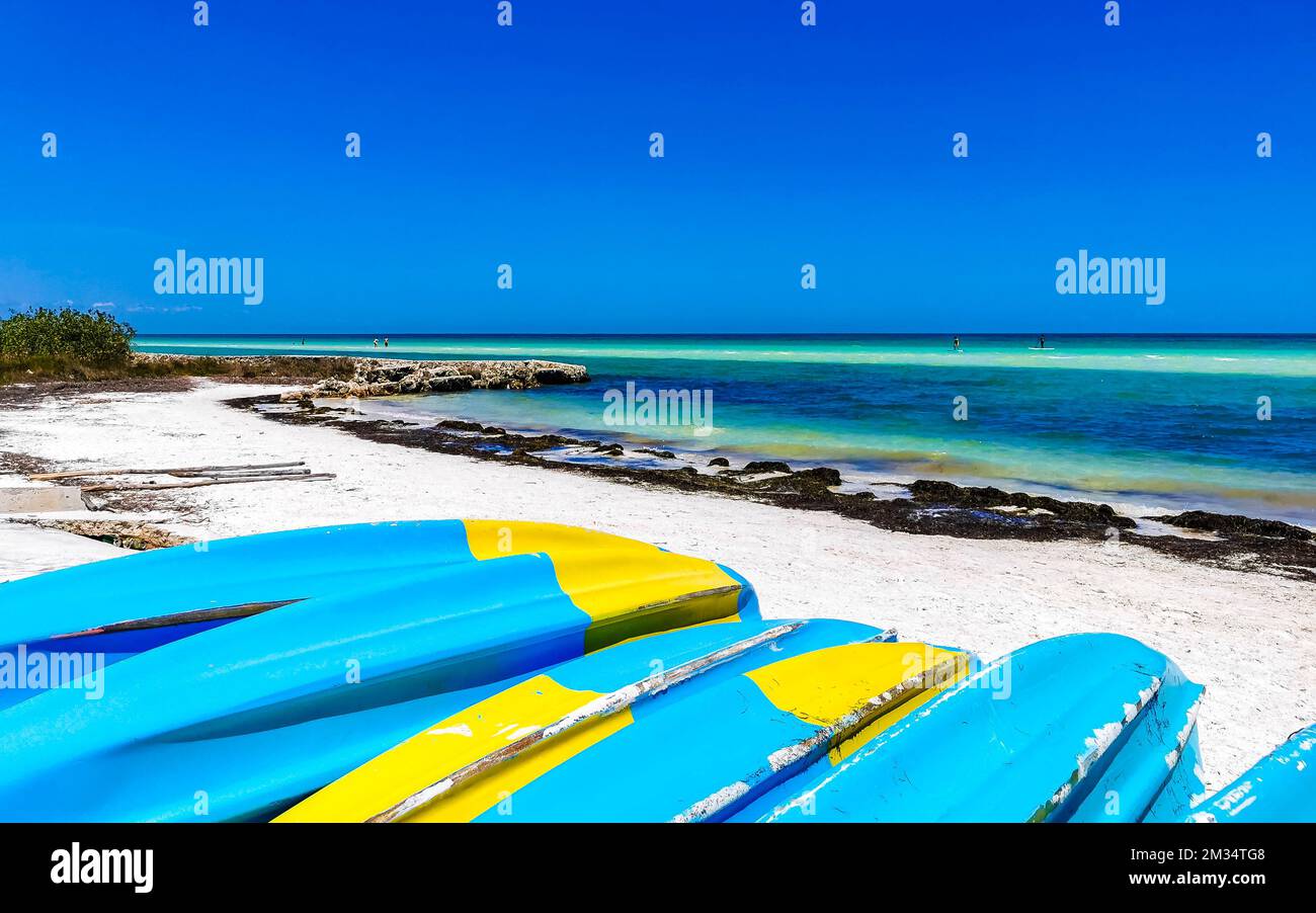 Canoes and boats for water activities on the beach on Isla Holbox