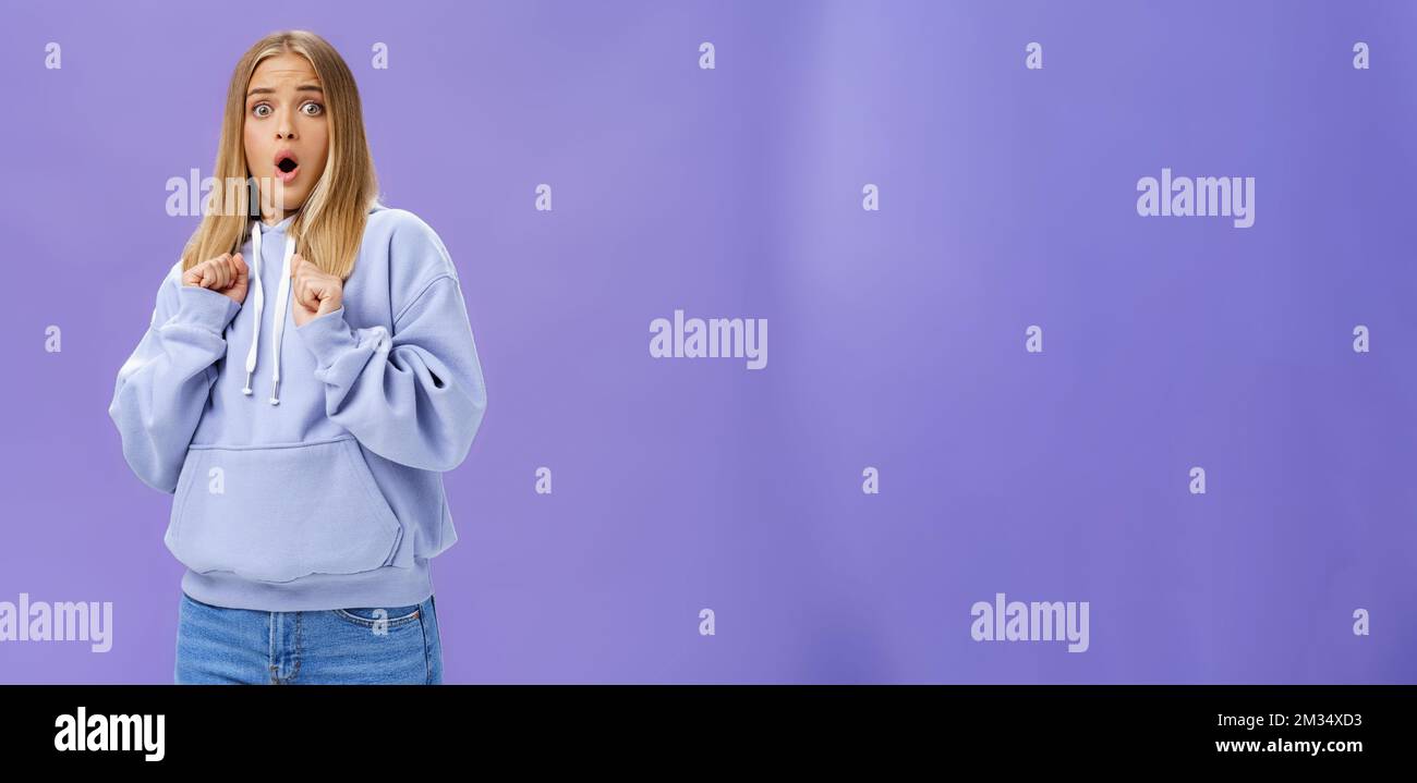 Woman scared of sudden loud noise in dark gasping looking shocked and