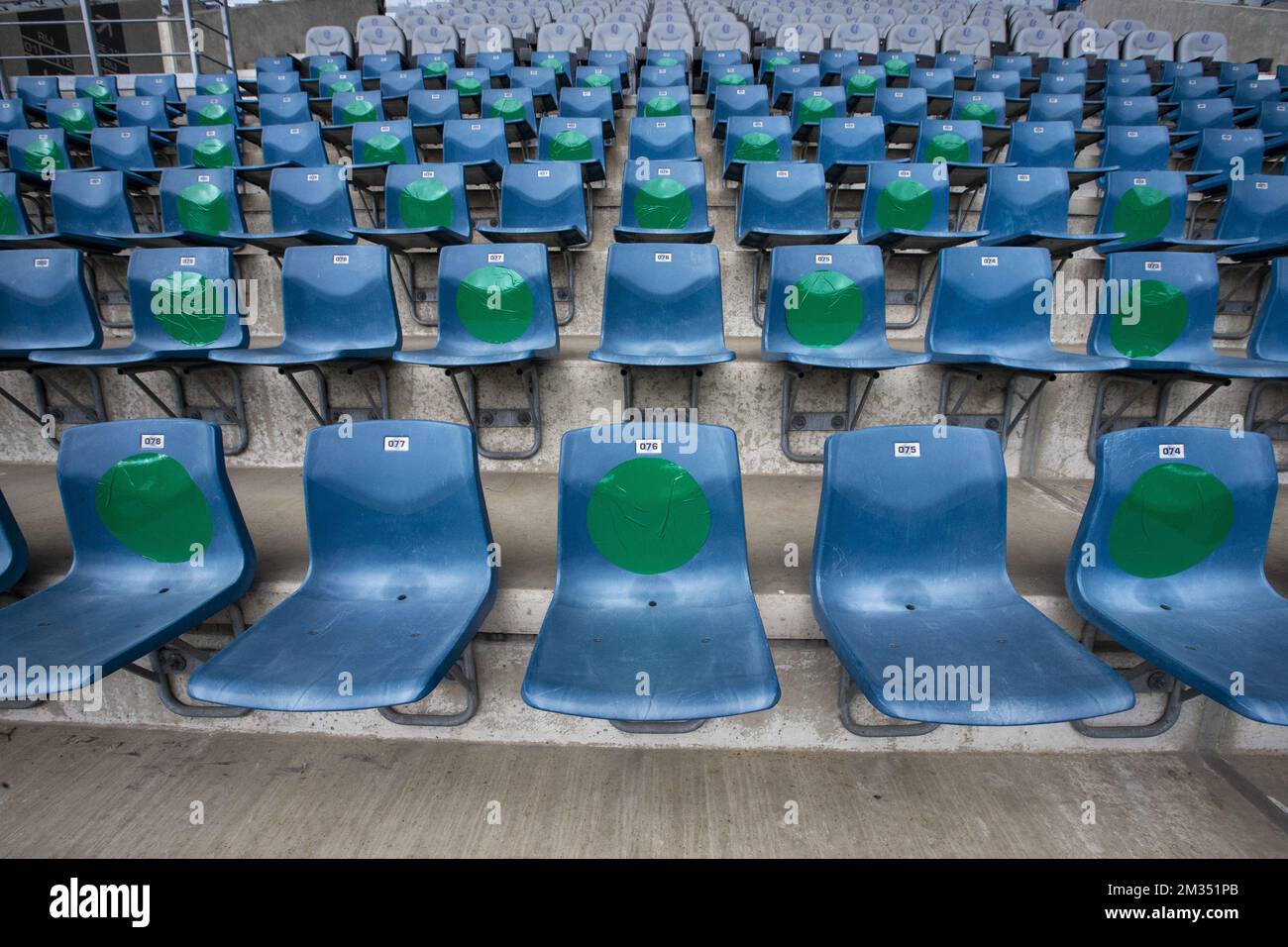 Illustration picture shows indications which seats should be left empty at a test event for 300 volunteer workers, with a performance by Compact Disk Dummies, organized by the city of Ghent, UZ Gent and The Arena Group at the Ghelamco Arena, in Ghent, Saturday 15 May 2021. The participants arrive in blocks of time so that it never gets too busy. They undergo a rapid test and must also share their contact information. They are given a fixed and numbered seat, must keep their mouth mask on and keep their distance. During this event, it will be examined how rapid tests can be used in a smooth and Stock Photo