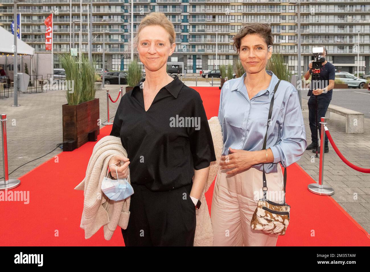 actress Joke Devynck (R) and girlfriend Valery pictured during the first edition of the FFO Night, an alternative to the Oostende Film festival, Saturday 19 June 2021, in Oostende. The FFO Night starts with the avant-premiere of the film 'My father is a saucisse'. BELGA PHOTO JAMES ARTHUR GEKIERE Stock Photo