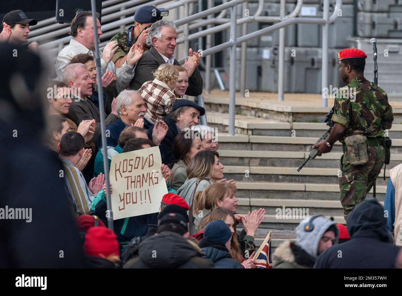 Soldier and Kosovan crowd during filming for series 6 of Netflix The Crown on location in Southend on Sea, Essex, UK. For Tony Blair in Kosovo set Stock Photo