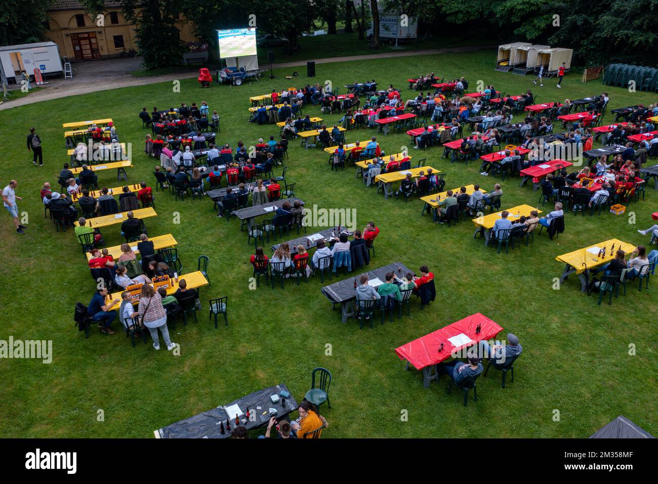 Aerial drone picture shows Red Devils' supporters pictured during the broadcast of the match on a large screen in the 'Kasteelpark' in Zwevezele, during the round of 16 game of the Euro 2020 European Championship between the Belgian national soccer team Red Devils and Portugal, in Sevilla, Spain, Sunday 27 June 2021. BELGA PHOTO KURT DESPLENTER  Stock Photo