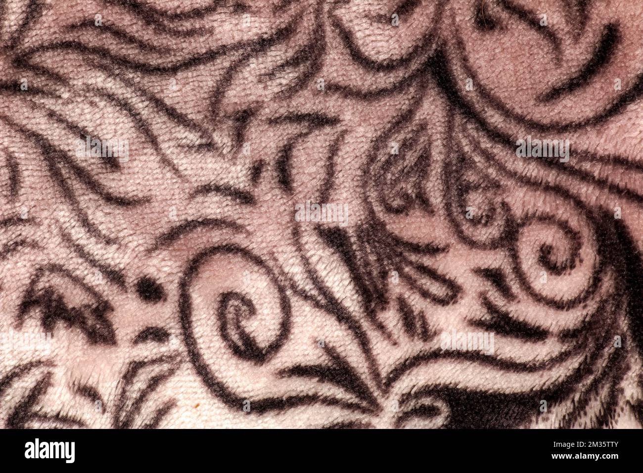 Close-up pattern of fleece fabric with leopard pattern. Brown-beige and ...