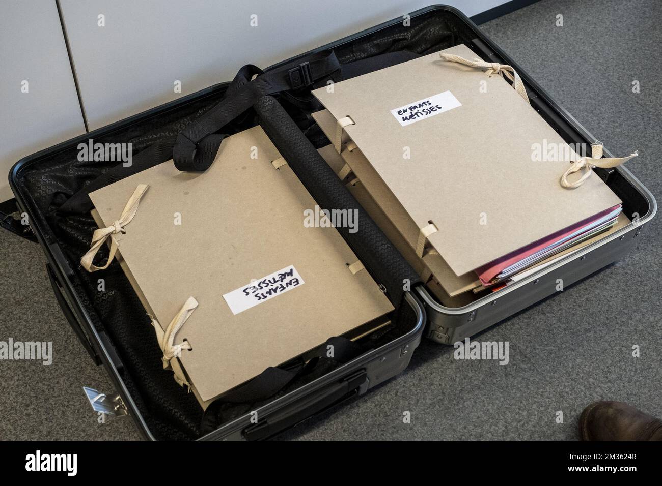 Illustration picture shows folders with 'Enfants Metisses' written on it at a hearing in the case of five Belgian-Congolese women against the Belgian State for crimes against humanity, Thursday 14 October 2021. Five women, born in Congo, from Congolese mothers and European colonial fathers, are among the victims of the segregation of mixed-race children in the Congo at the end of the colonial period, they were taken from their mothers and placed in orphanages. BELGA PHOTO HADRIEN DURE Stock Photo