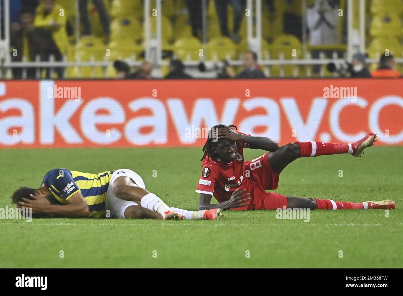Fenerbahce Nazim Sangare and Antwerp's Pierre Junior Dwomoh lie injured on the ground during a match between Turkish team Fenerbahce and Belgian soccer team Royal Antwerp FC, Thursday 21 October 2021 in Istanbul, Turkey, on the third day of the UEFA Europa League group stage, in group D. BELGA PHOTO LAURIE DIEFFEMBACQ Stock Photo