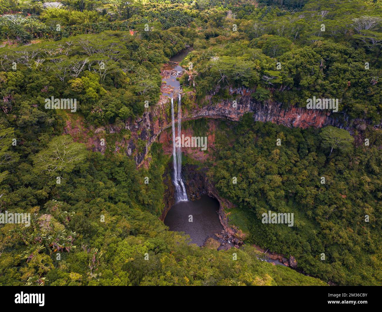 Chamarel Waterfall in Mauritius with riviere du Cup in Riviere noire district. Colorful panoramic landscape about the waterfall and valley and river t Stock Photo