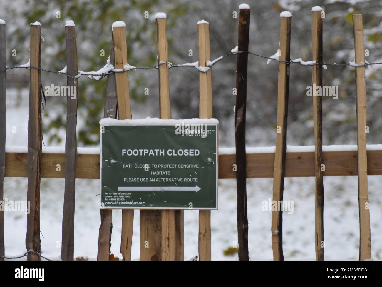 Sign: 'Footpath closed. Path closed to protect sensitive habitats'. Stock Photo