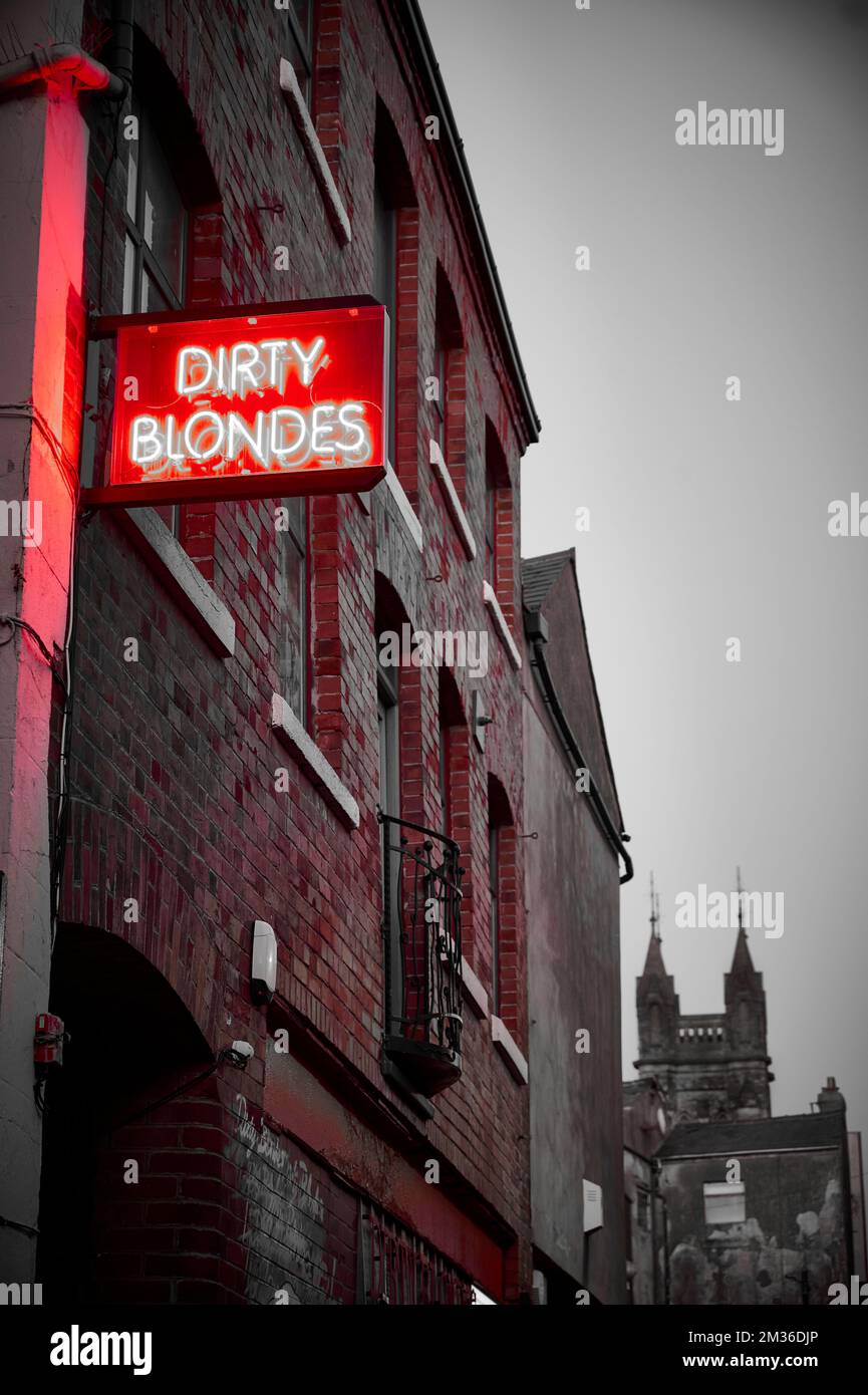'Dirty blondes'  bar and restaurant neon sign in alleyway in Blackpool,UK Stock Photo
