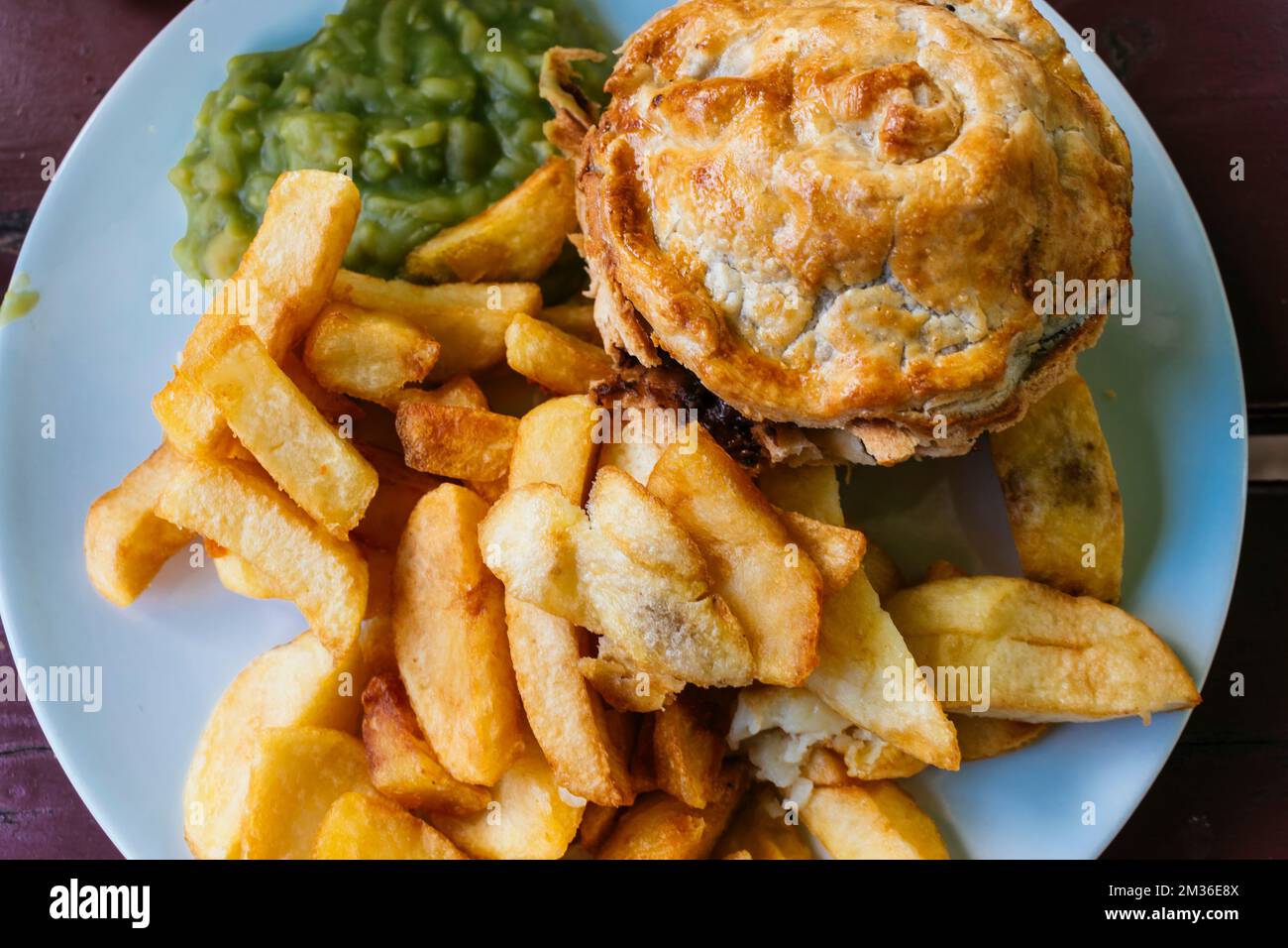 Traditional english cuisine. Steak ale pie, Mashed Potato and Mushy Peas. The Nottingham House
