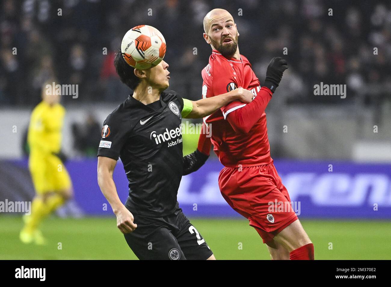 Eintracht's Makoto Hasebe and Antwerp's Dorian Dessoleil fight for the ball during a soccer game between German Eintracht Frankfurt and Belgian Royal Antwerp FC, Thursday 25 November 2021 in Frankfurt, Germany, game five (out of six) in Group D of the UEFA Europa League group stage. BELGA PHOTO LAURIE DIEFFEMBACQ Stock Photo