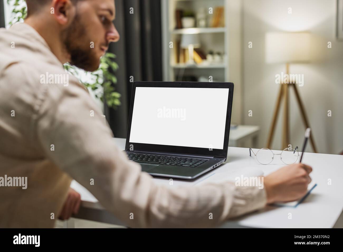 Man with blank screen laptop Stock Photo