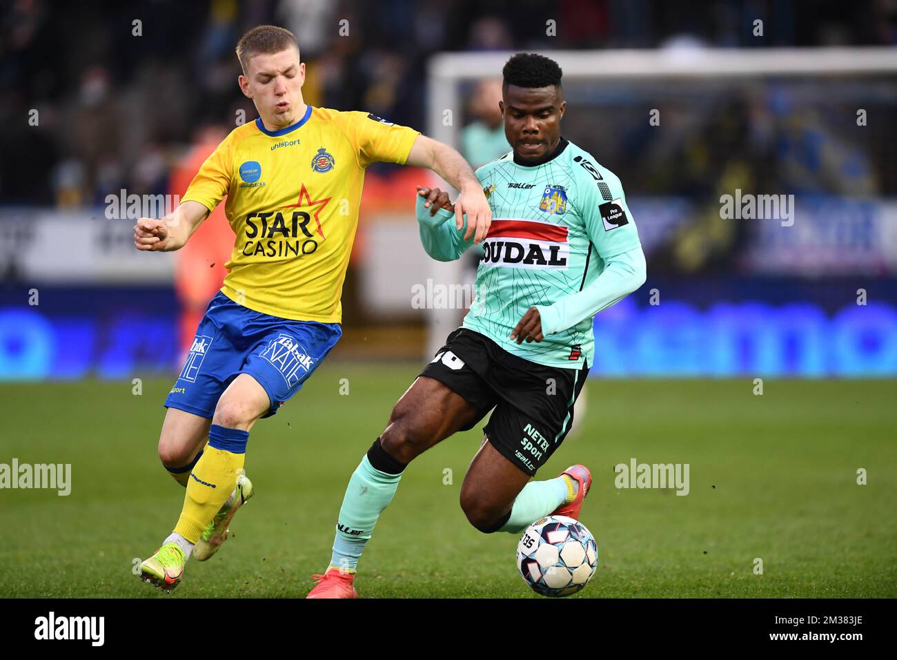 Waasland-Beveren's Tom Reyners and Westerlo's Kouya Mabea fight for the ball during a soccer match between Waasland-Beveren and KVC Westerlo, Sunday 30 January 2022 in Beveren, on day 18 of the '1B Pro League' second division of the Belgian soccer championship. BELGA PHOTO JOHN THYS Stock Photo