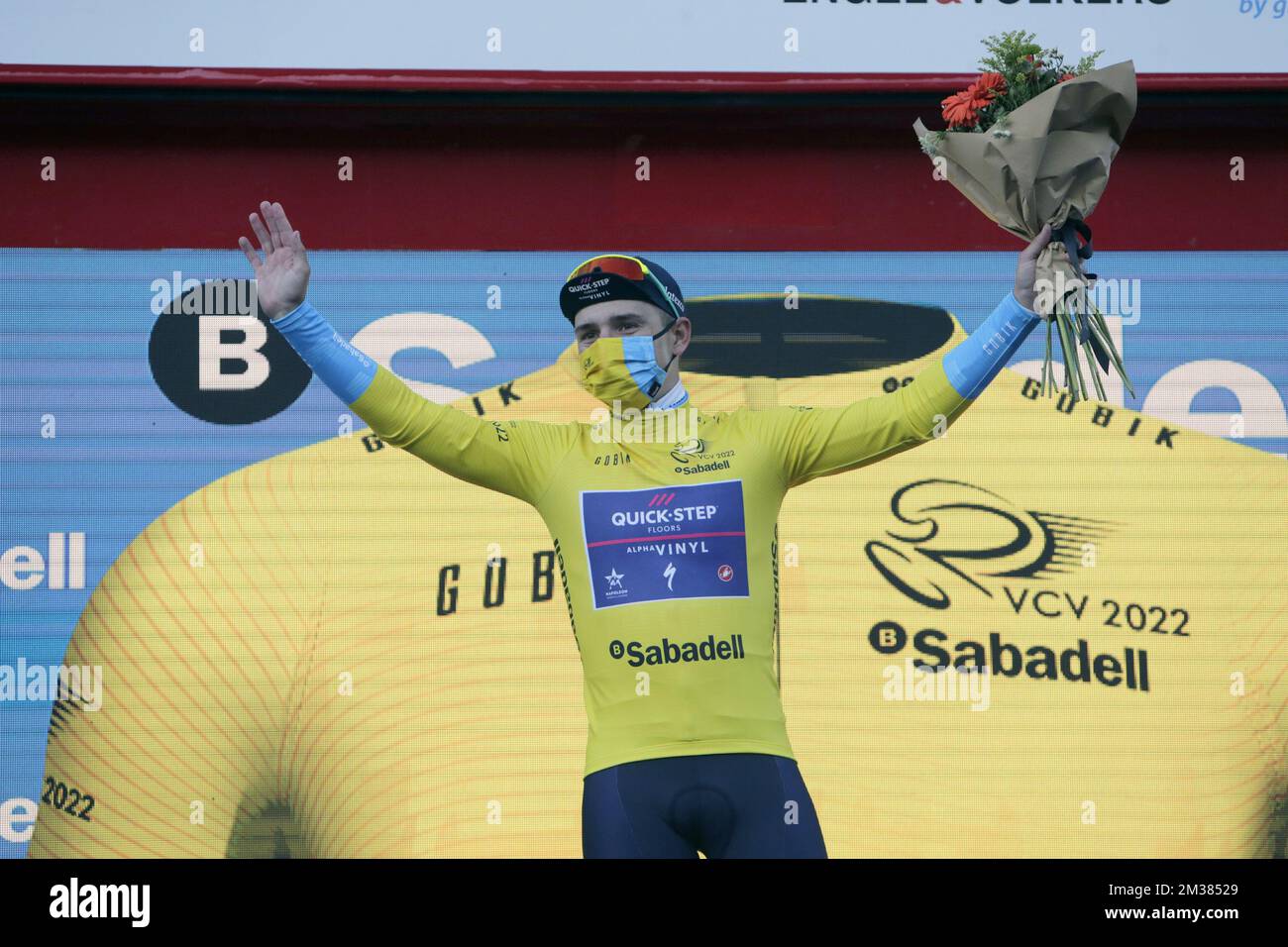 Belgian Remco Evenepoel of Quick-Step Alpha Vinyl wearing the yellow jersey celebrates on the podium after winning stage one of the 'Volta a la Comunitat Valenciana' Tour of Valencia cycling race in Spain, on Wednesday 02 February 2022 from Les Alqueries to Torralba del Pinar. The Tour is taking place from February 2nd to the 6th. BELGA PHOTO JUAN CARLOS CARDENAS  Stock Photo