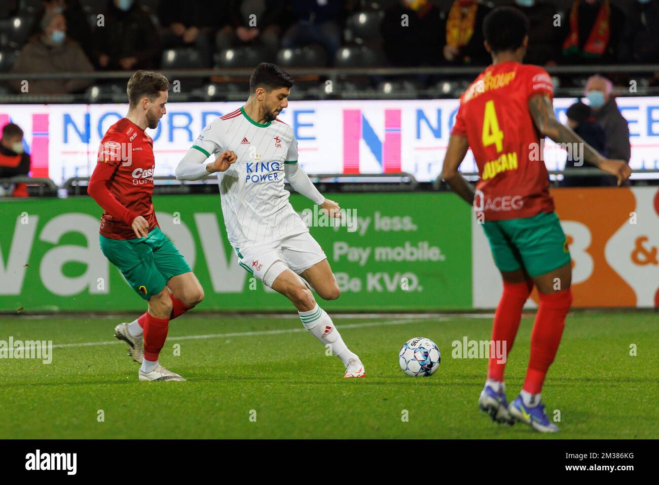 Oostende's Robbie D'Haese and OHL's Cenk Ozkacar fight for the ball