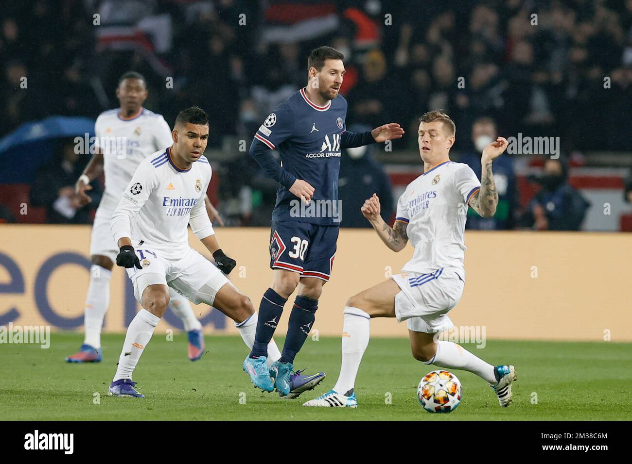 PSG's Lionel Messi and Real's Toni Kroos fight for the ball during a soccer game between French club Paris Saint-Germain and Spanish club Real Madrid, Tuesday 15 February 2022 in Paris, in the round of sisteen (1/8 final) of the UEFA Champions League. BELGA PHOTO BRUNO FAHY Stock Photo
