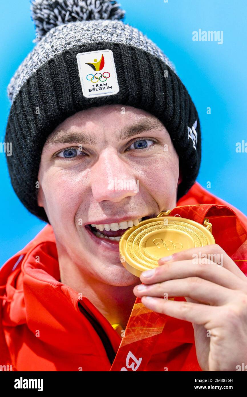 Belgian speed skater Bart Swings poses with his gold medal for the