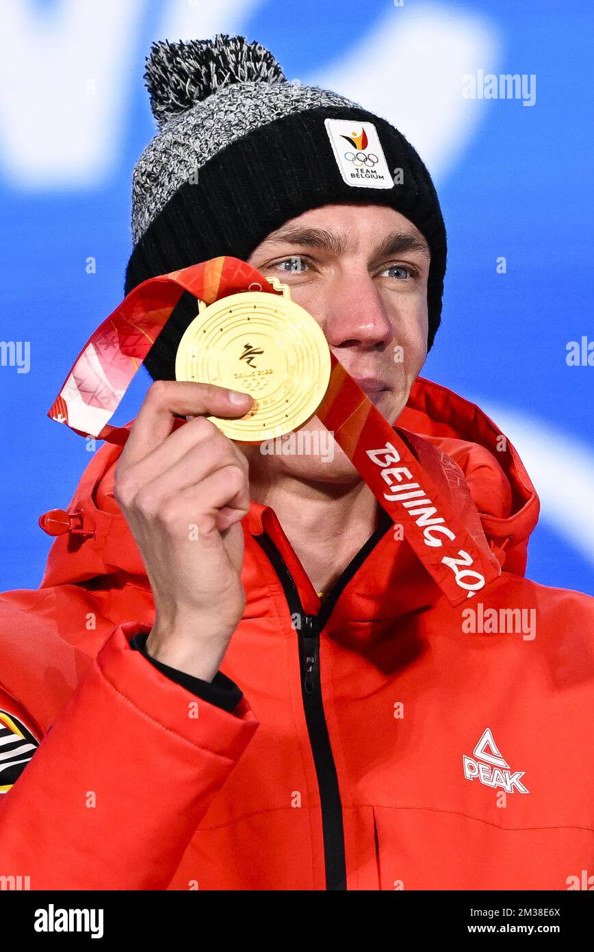Belgian speed skater Bart Swings, winner of the gold medal celebrates on  the podium during the medal ceremony of the men's mass start speed skating  event at the Beijing 2022 Winter Olympics