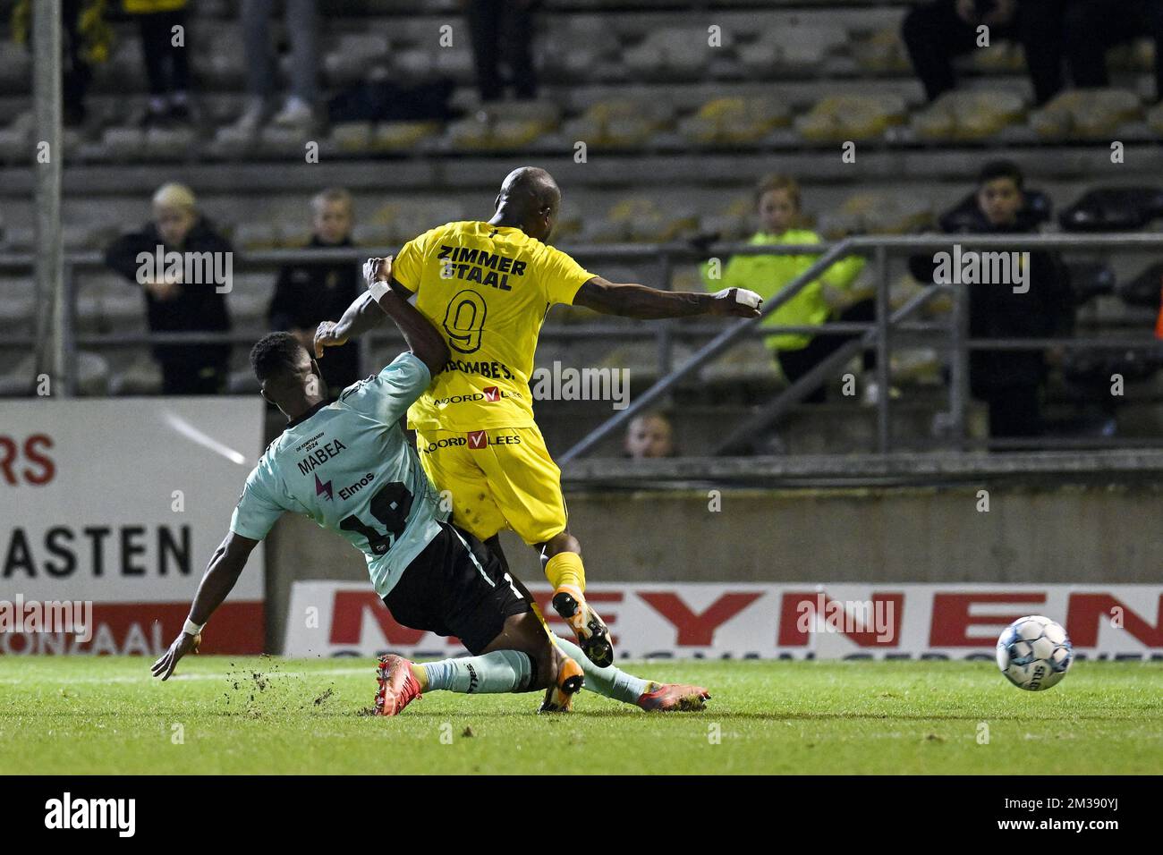 Lierse's Stallone Limbombe is tackled by 18 Westerlo's Kouya Mabea in the penalty box during a soccer match between Lierse Kempenzonen and KVC Westerlo, Wednesday 16 March 2022 in Lier, a delayed game of day 21 of the '1B Pro League' second division of the Belgian soccer championship. BELGA PHOTO TOM GOYVAERTS Stock Photo