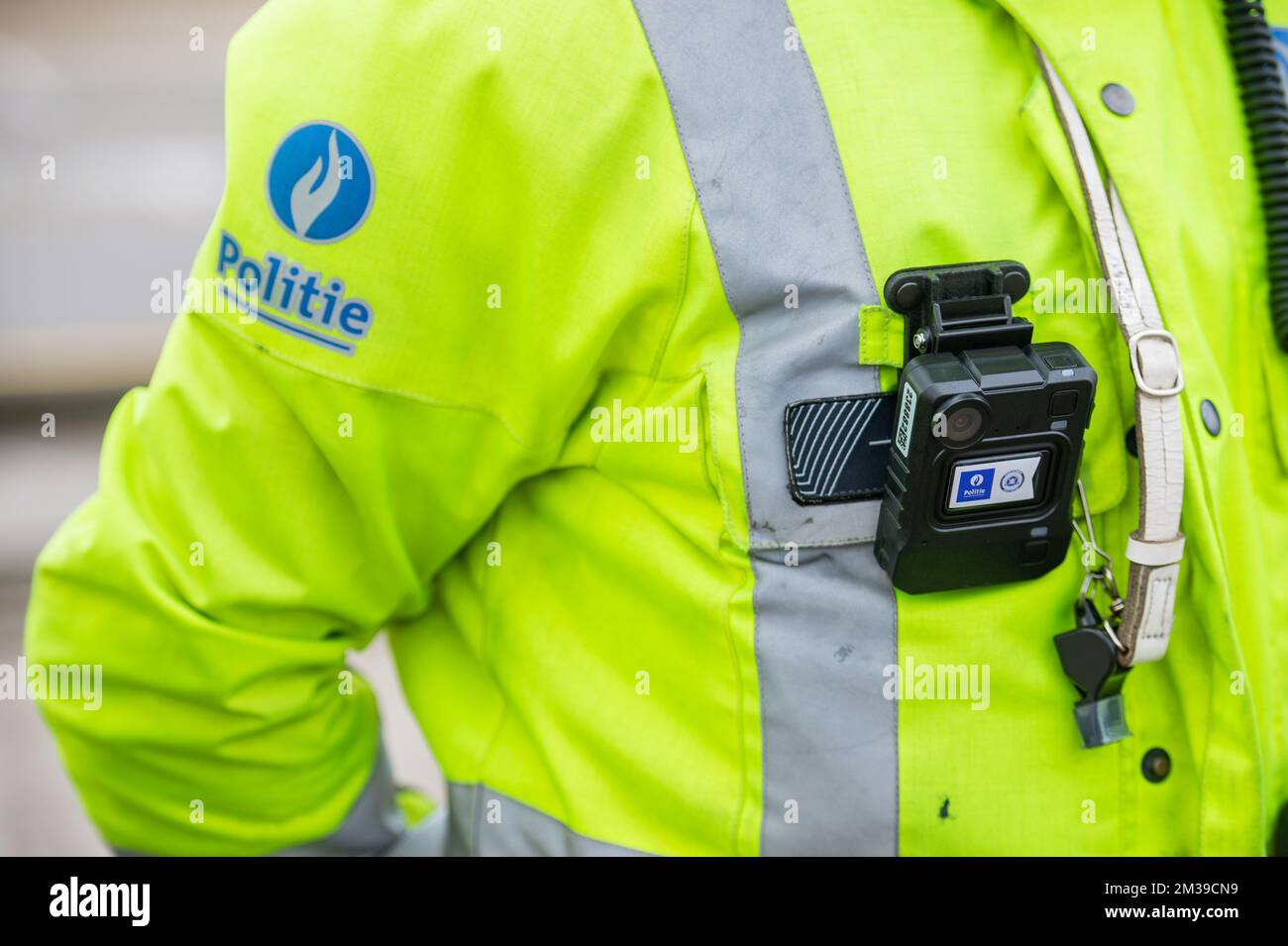 Illustration image shows a police officer wearing a bodycam during a