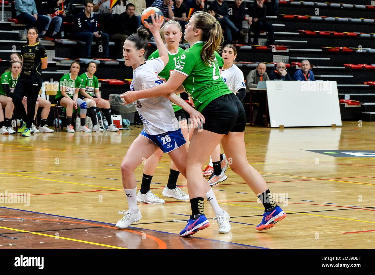 Camille Himberlin (26) of Femina Vise and Julie Coenen (27) of Initia  Hasselt pictured during a game between Initia Hasselt and Handball Femina  Vise, Saturday 09 April 2022, in Hasselt, the women's