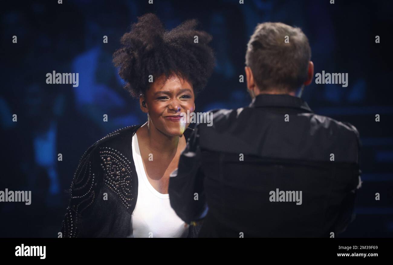 Finalist Maicha and her coach Christophe Willem perform at the final of