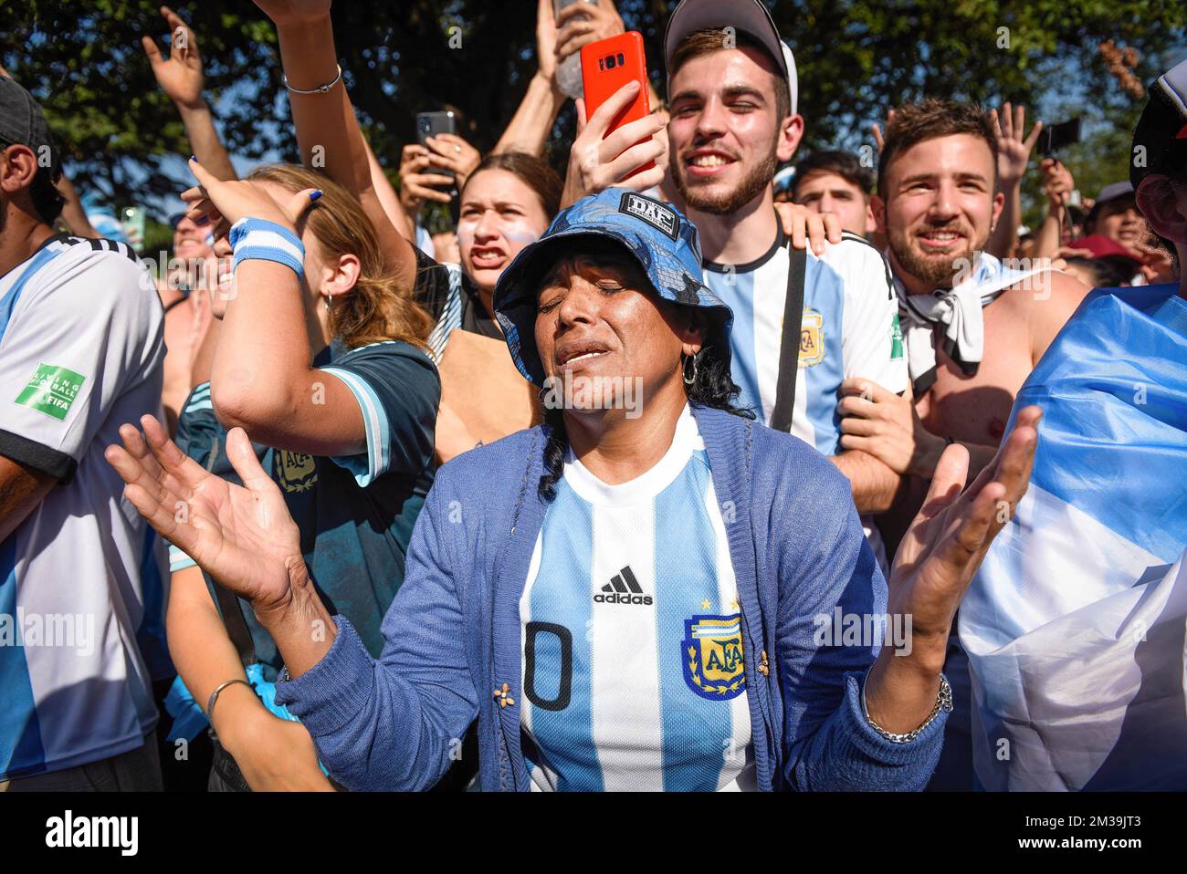 An Argentine soccer fan gestures while watching their team's FIFA World