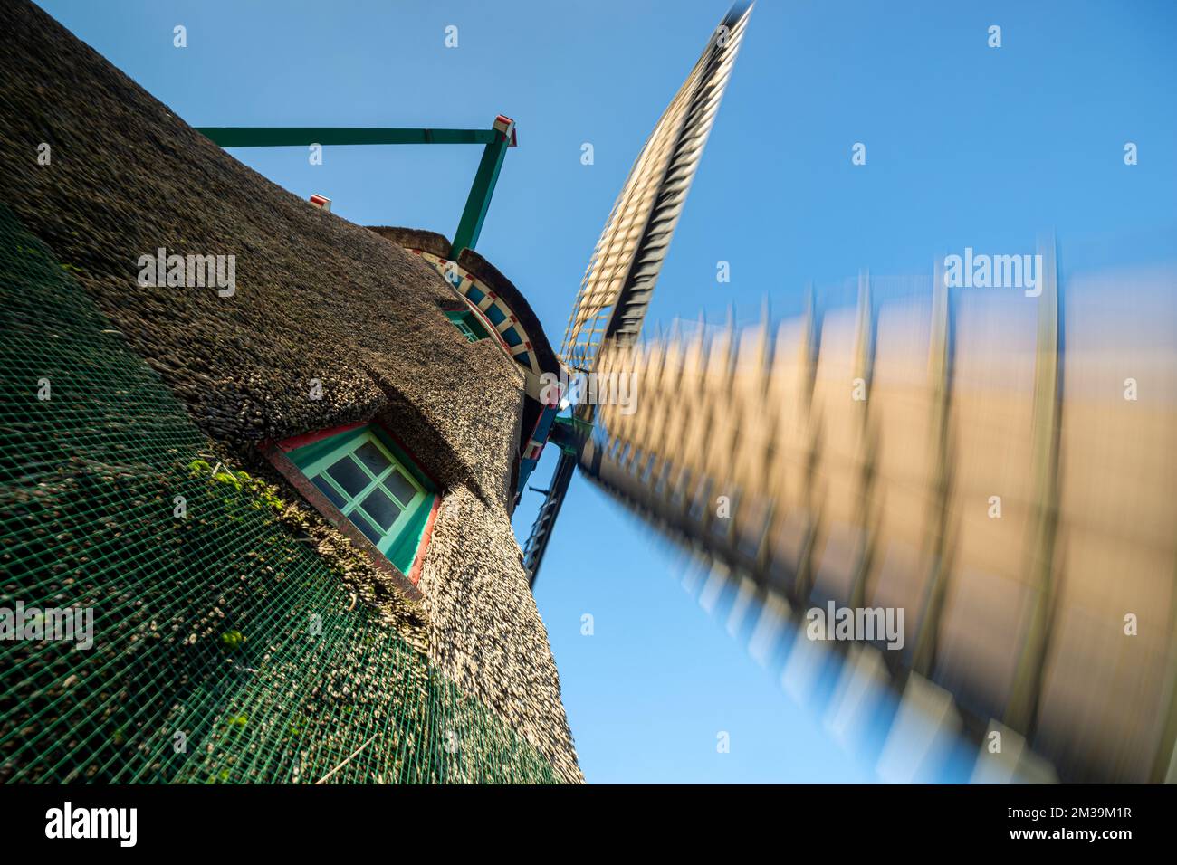 Dutch Windmill in rotation. Traditional windmill viewed at a wide angle ...