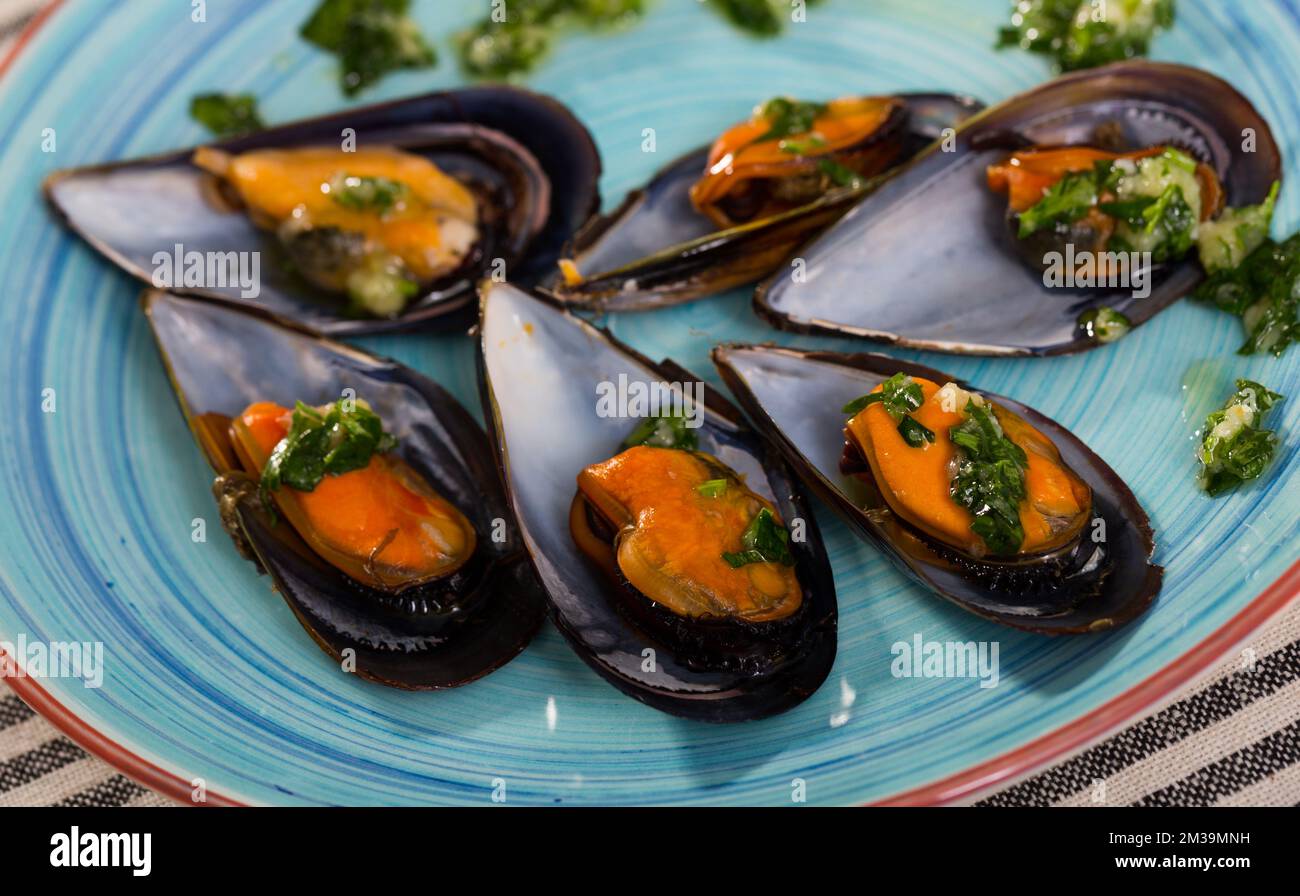 Baked mussels with garlic Stock Photo Alamy