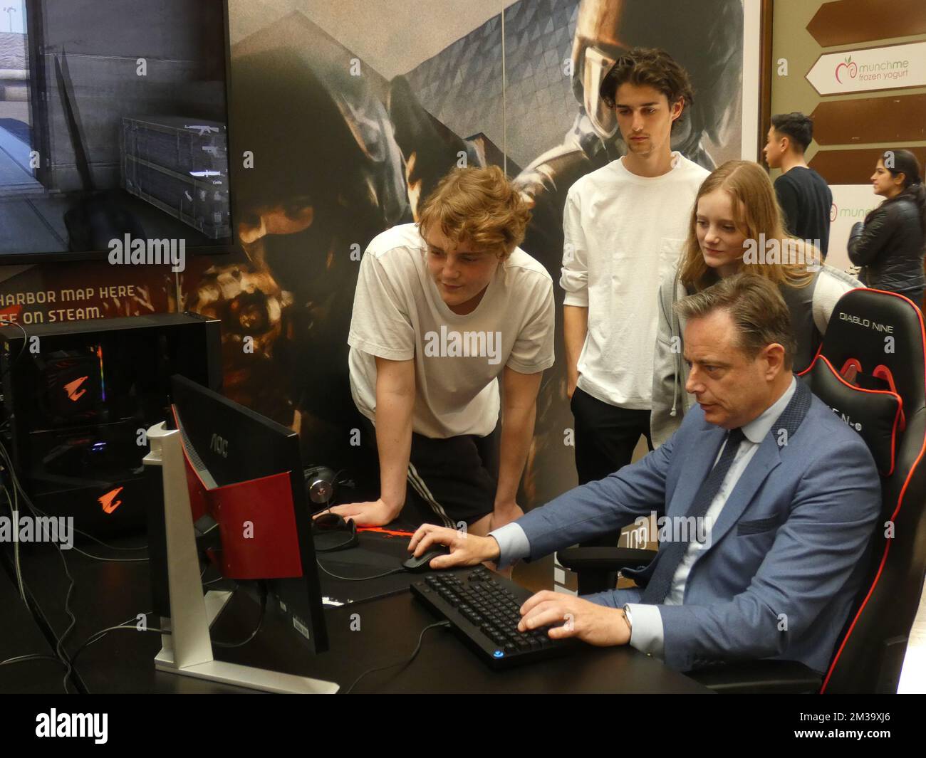 N-VA's Bart De Wever, with two of his children Simon (rear L) and Liesbet (rear R) and an unidentified friend of Simon (rear C), pictured as he plays Counter Strike against comedian Boeva (not pictured), at the press presentation of the map 'Antwerp Harbor' and kick-off of the World Cup Counter-Strike that takes place in Antwerp, Saturday 07 May 2022. The World Counter-Strike Championship will take place from May 19 to 22. More than 50,000 gaming fanatics from home and especially abroad will come to the Sportpaleis to see their favorite teams at work. To put the event in the spotlight, the ci Stock Photo