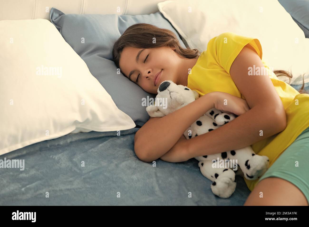 Sleeping and dreaming kids. Kid lying and sleeping on bed hug toy