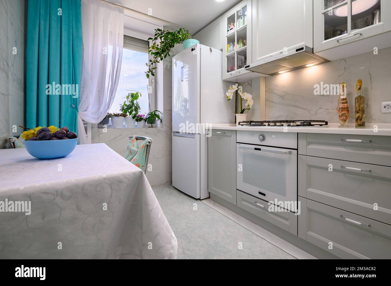 New light grey modern well designed kitchen interior Stock Photo - Alamy