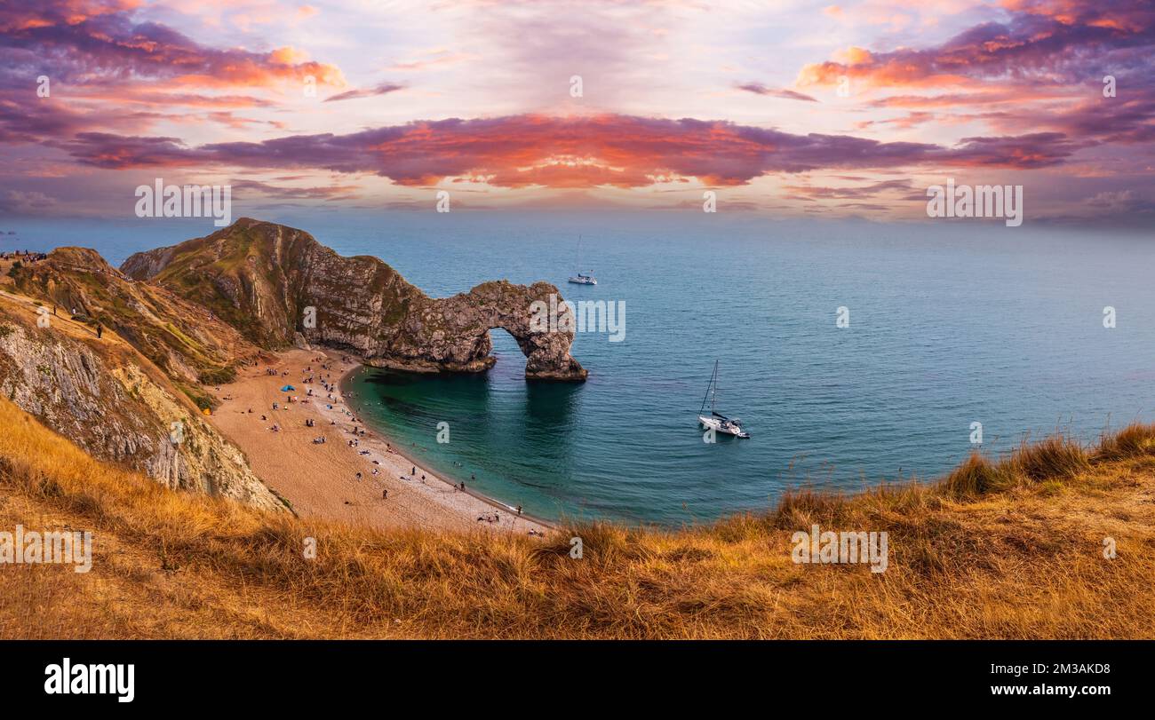 Durdle Door at Dorset in England, United Kingdom. people on the beach Stock Photo