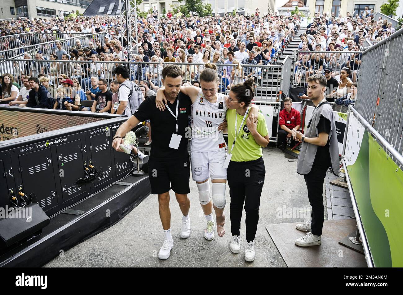 Belgium's Laure Resimont leaves the pitch after being injured during a 3x3  basketball game between the Belgian Cats and Brasil, in the Women's eighth  final round at the FIBA 2022 world cup,