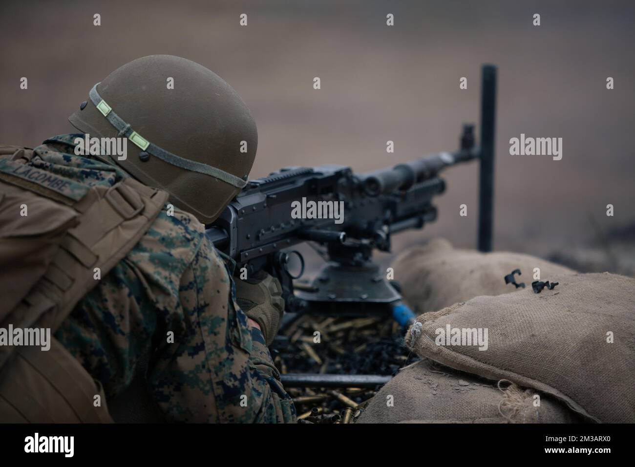 U.S. Marine Corps Pfc. Wayne Lacombe, a machine gunner with 2nd Battalion, 8th Marines, engages marathon autonomous robotic target systems during a live fire exercise at range G-36 on Marine Corps Base Camp Lejeune, North Carolina, Dec. 8, 2022. This exercise demonstrates the training capabilities of Range Training Area Management (RTAM), Marine Corps Installations East, as RTAM supports II Marine Expeditionary Force in producing the next generation of warfighters. (U.S. Marine Corps photo by Cpl. Tanner Bernat) Stock Photo