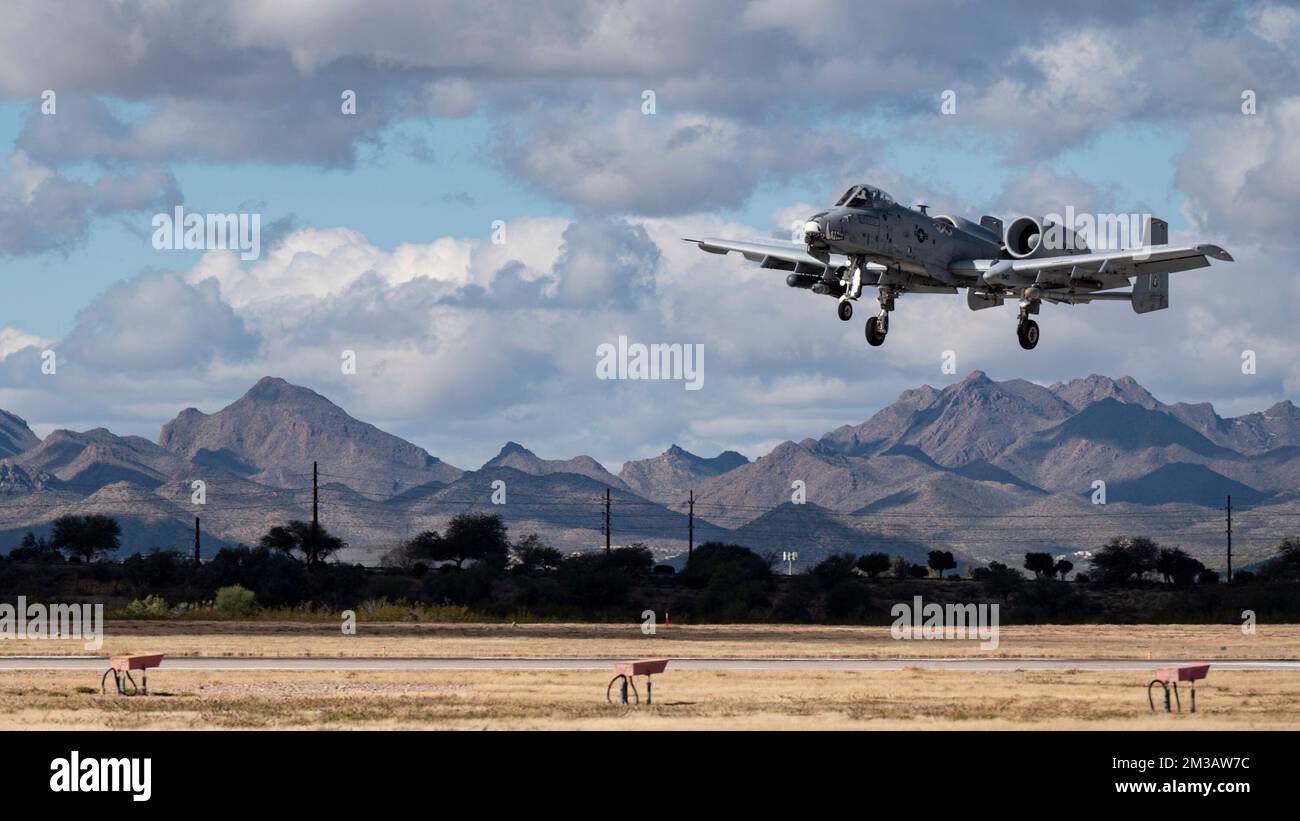 A U.S. Air Force A-10 Thunderbolt II assigned to the 355th Wing flies over the flight line with its landing gear down over the flight line at Davis-Monthan Air Force Base, Ariz., Dec. 13, 2022. A-10s are the first USAF aircraft specially designed for close air support of ground forces. They are simple, effective and survivable twin-engine jet aircraft that can be used against light maritime attack aircraft and all ground targets, including tanks and other armored vehicles (U.S. Air Force photo by Staff Sgt. Kristine Legate) Stock Photo