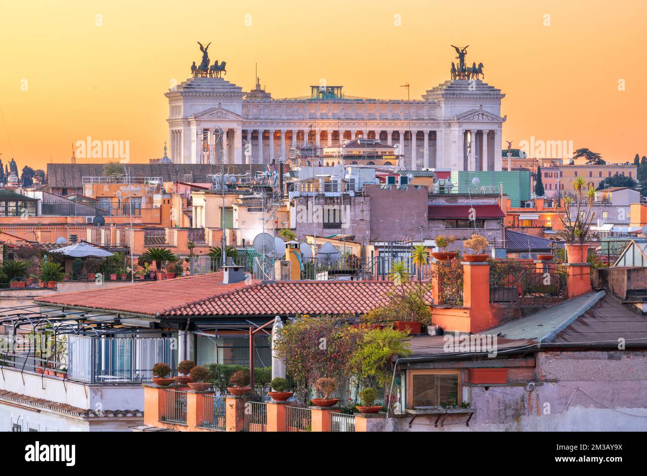 Rome, Italy rooftop cityscape at dusk with Victor Emmanuel II Monument. Stock Photo
