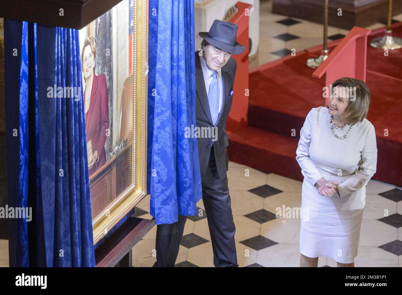Washington, United States. 14th Dec, 2022. Speaker of the House Nancy Pelosi, D-CA, admires her portrait as her husband, Paul Pelosi, looks on during a ceremony in Statuary Hall at the U.S. Capitol in Washington, DC on Wednesday, December 14, 2022. Pelosi is the first female speaker of the house. Photo by Bonnie Cash/UPI Credit: UPI/Alamy Live News Stock Photo