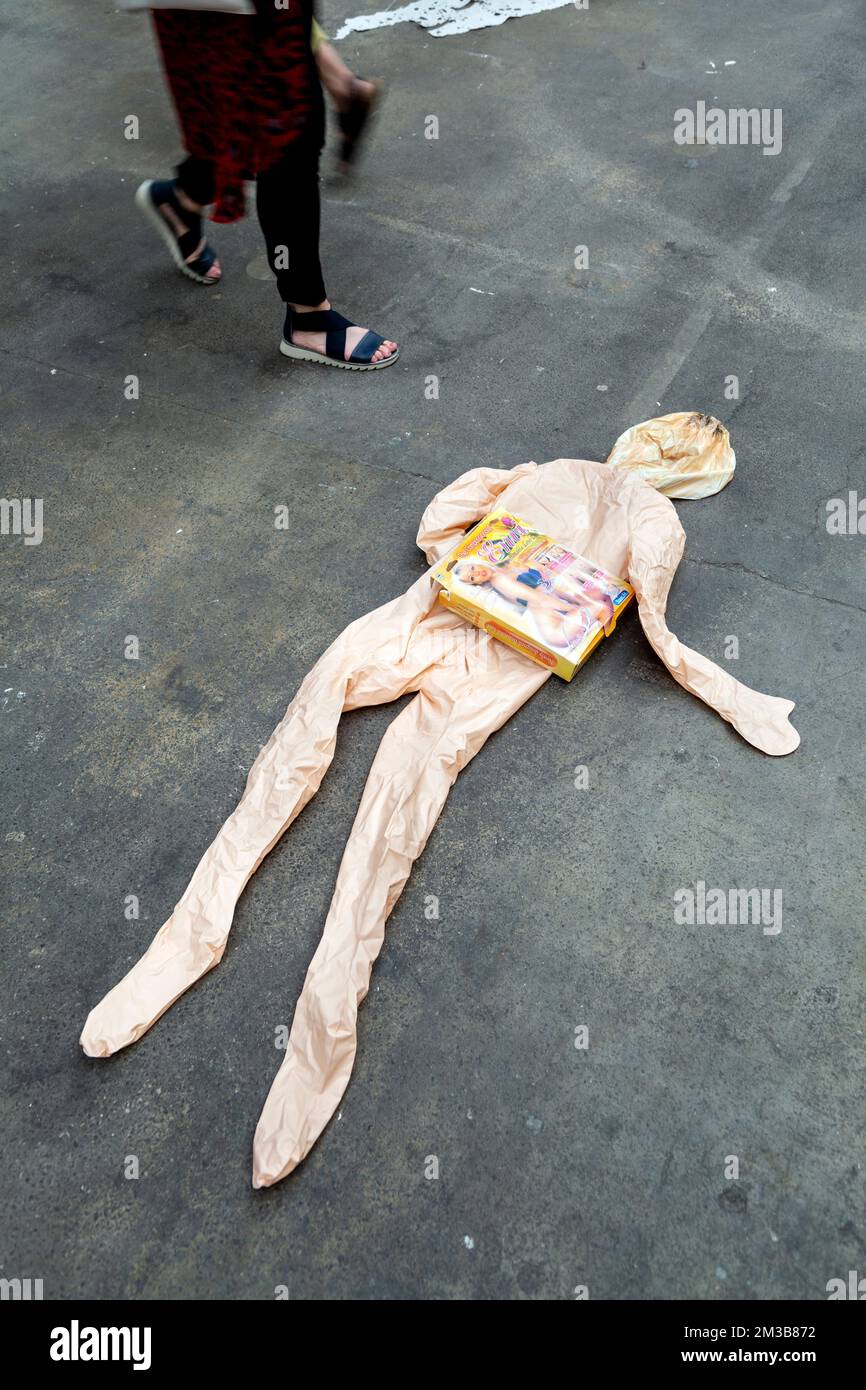 Blow-up doll artwork on the floor at the Free Range Show 2019 at the Old Truman Brewery, Brick Lane, London, UK Stock Photo