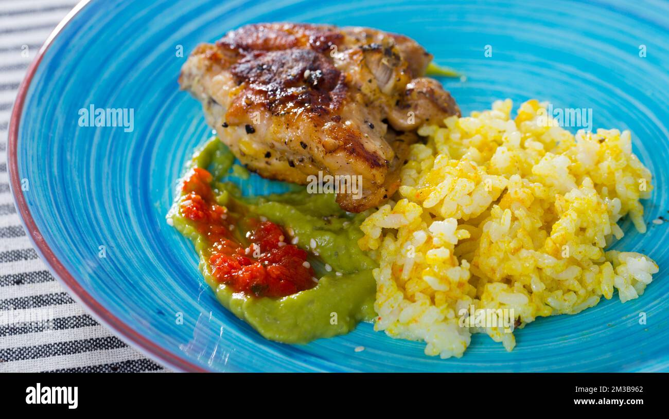 Fried chicken thighs with rice Stock Photo Alamy