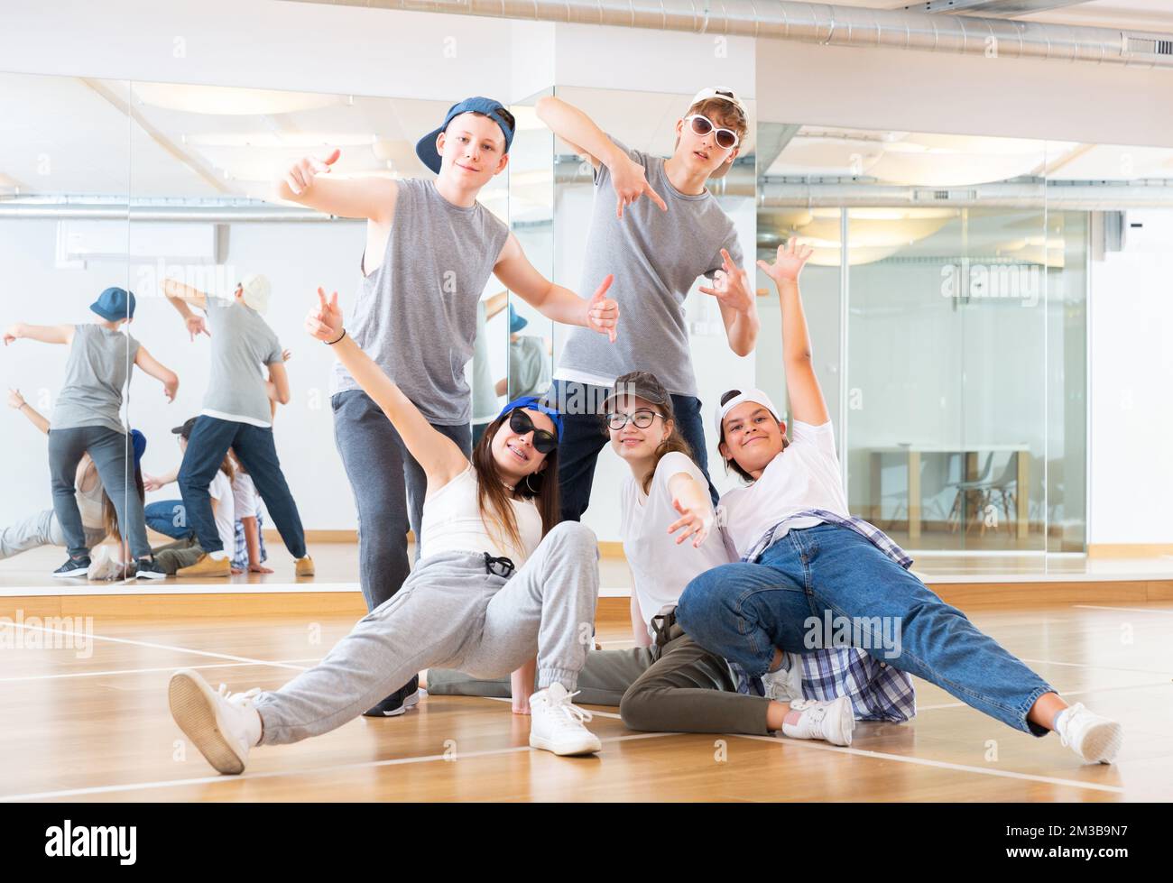 Teens hip hop dancers posing in studio Stock Photo - Alamy