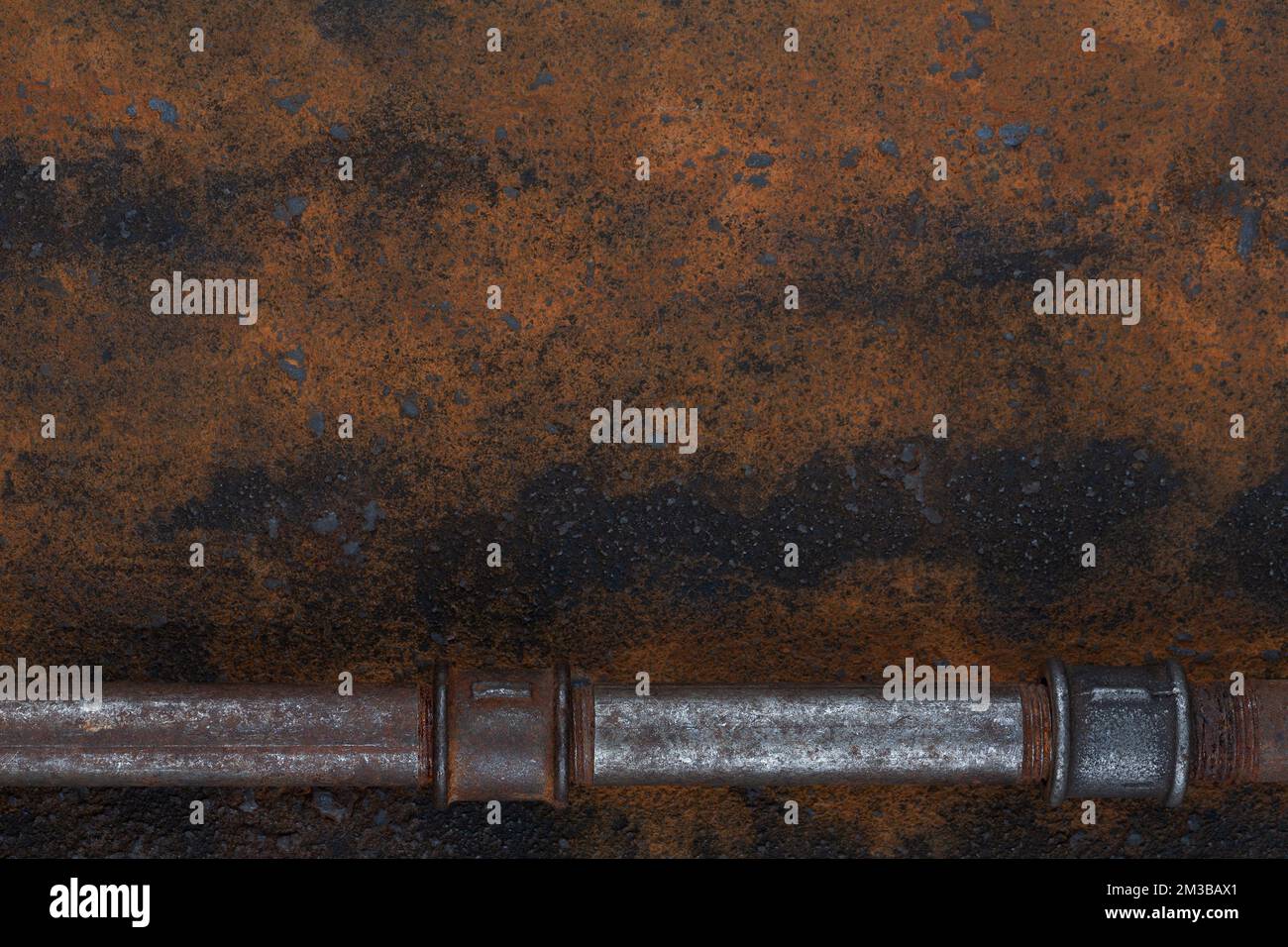 Old rusty valve pipes on rusty metal wall background Stock Photo - Alamy