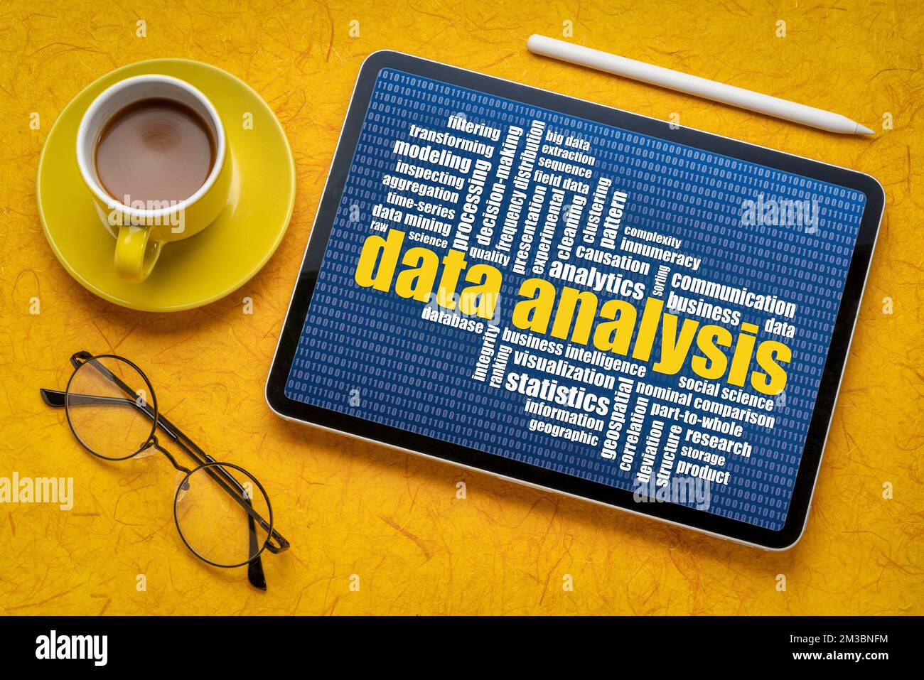 data analysis word cloud on a digital tablet, flat lay with coffee, information and technology concept Stock Photo