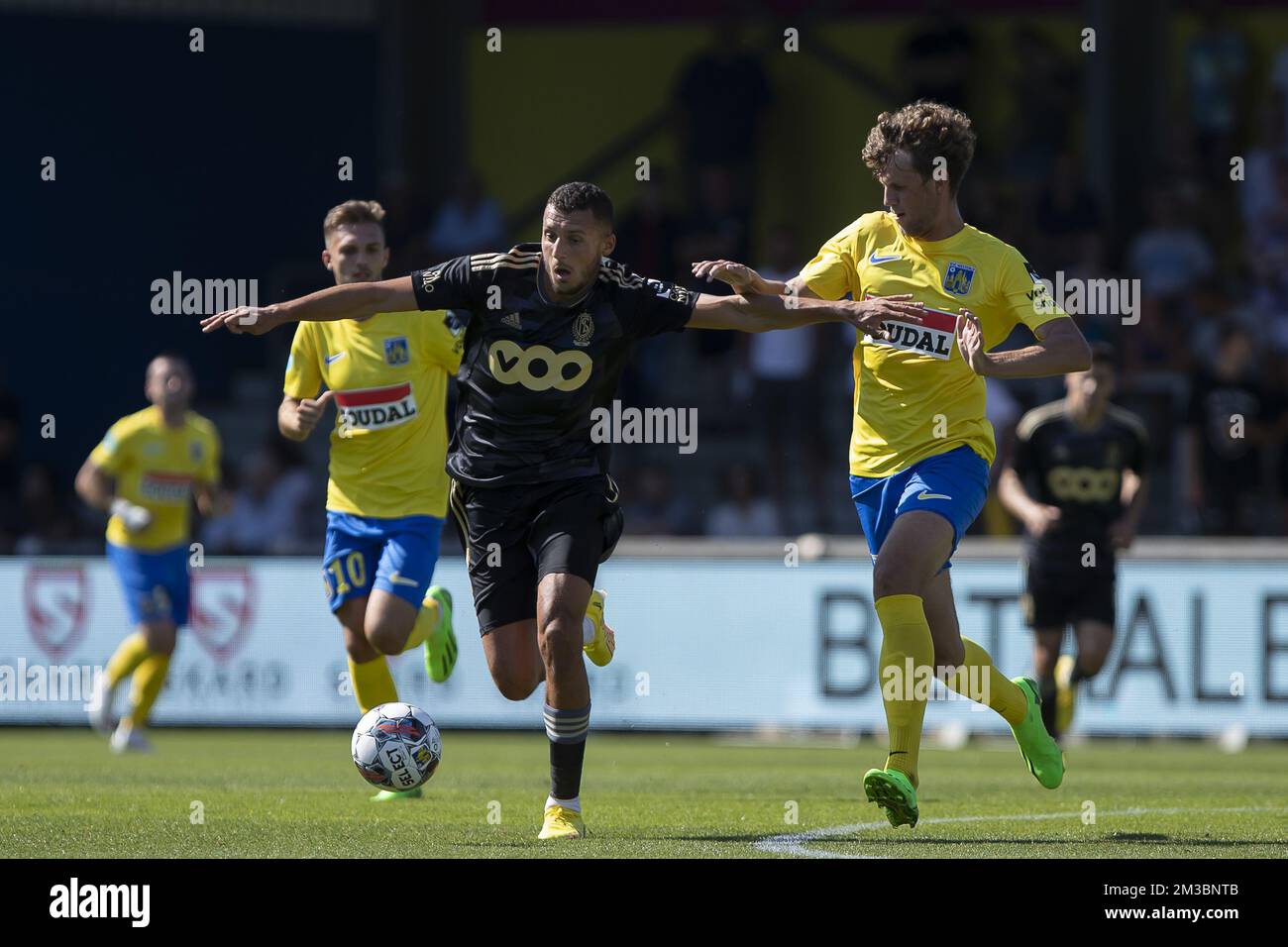 Standard's Selim Amallah and Westerlo's Nicolas Madsen pictured in action during a soccer match