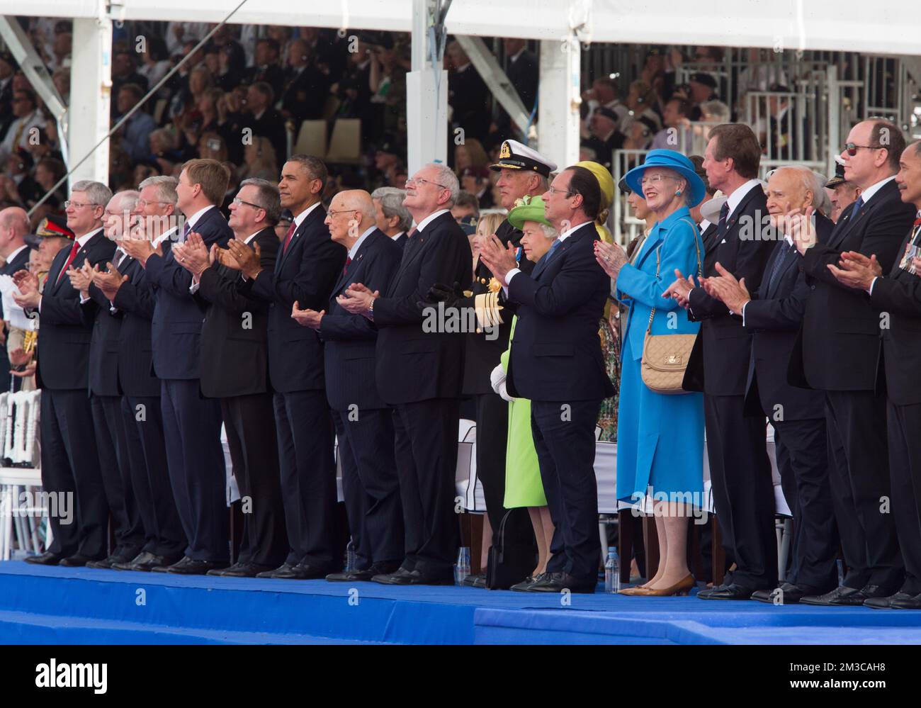 20140606 - OUISTREHAM, FRANCE: Canada's Prime Minister Stephen Harper, European Council president Herman Van Rompuy, King Philippe - Filip of Belgium, Netherland's King Willem-Alexander, Poland's President Bronislaw Komorowski, US President Barack Obama, Italy's President Giorgio Napolitano, Slovakia's president Ivan Gasparovic, Norway's King Harald V, Britain's Queen Elizabeth II, French President Francois Hollande and Danish Queen Margrethe and Luxembourg's Grand Duke Henri attend a ceremony as part of the events marking the 70th anniversary of the World War II Allied landings in Normandy in Stock Photo