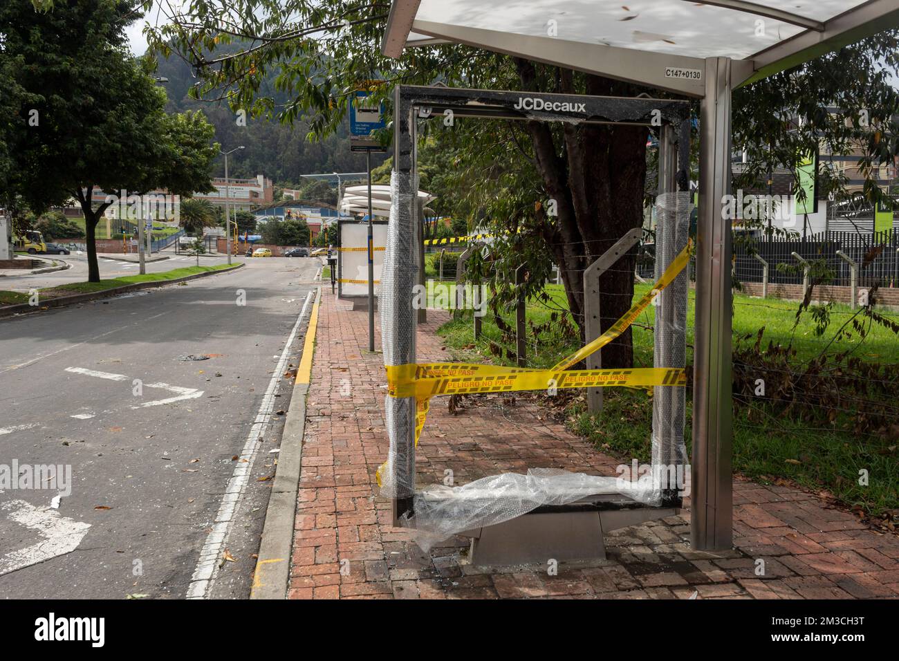 BOGOTA, COLOMBIA -  A bus stop damaged with breaking glass during colombian paro nacional marches at north city Stock Photo