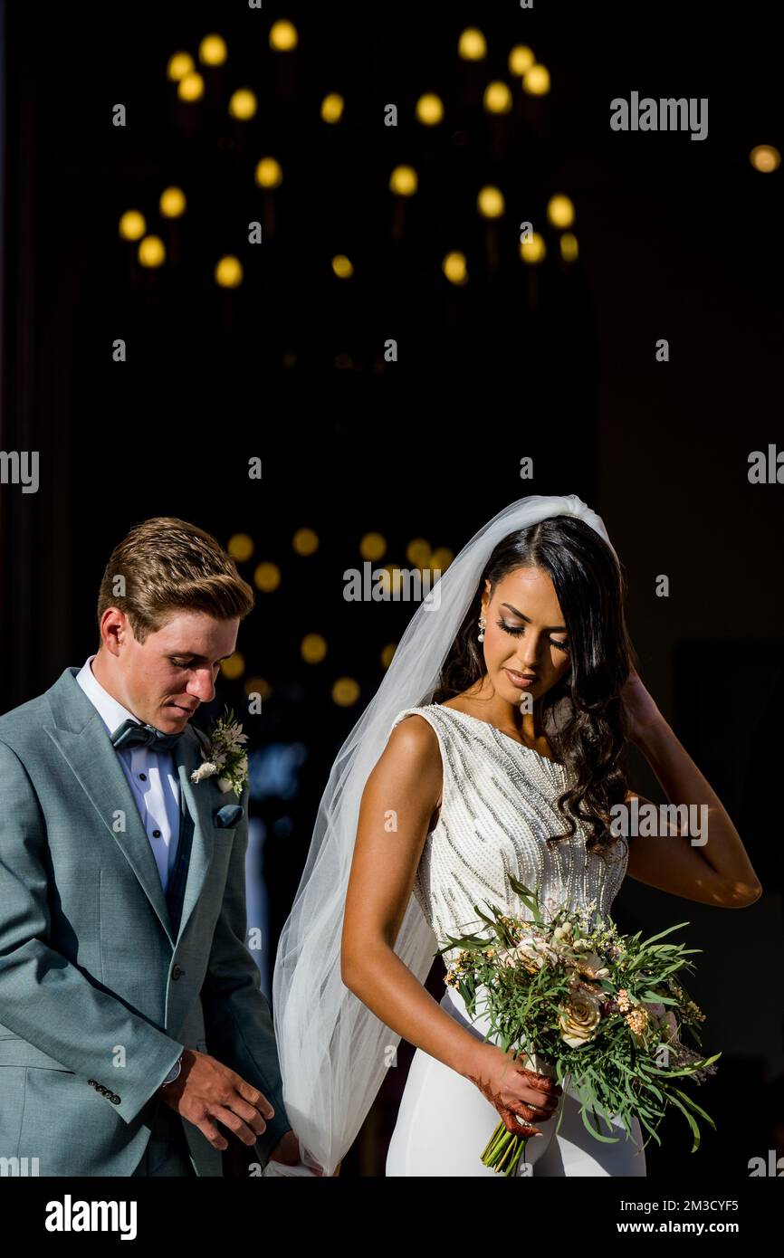 Remco Evenepoel helps his wife Oumaima Oumi Rayane with the long veil, after the wedding of Belgian cyclist Remco Evenepoel and Oumi Rayane, Sunday 02 October 2022 in Dilbeek, Belgium. BELGA PHOTO JASPER JACOBS  Stock Photo