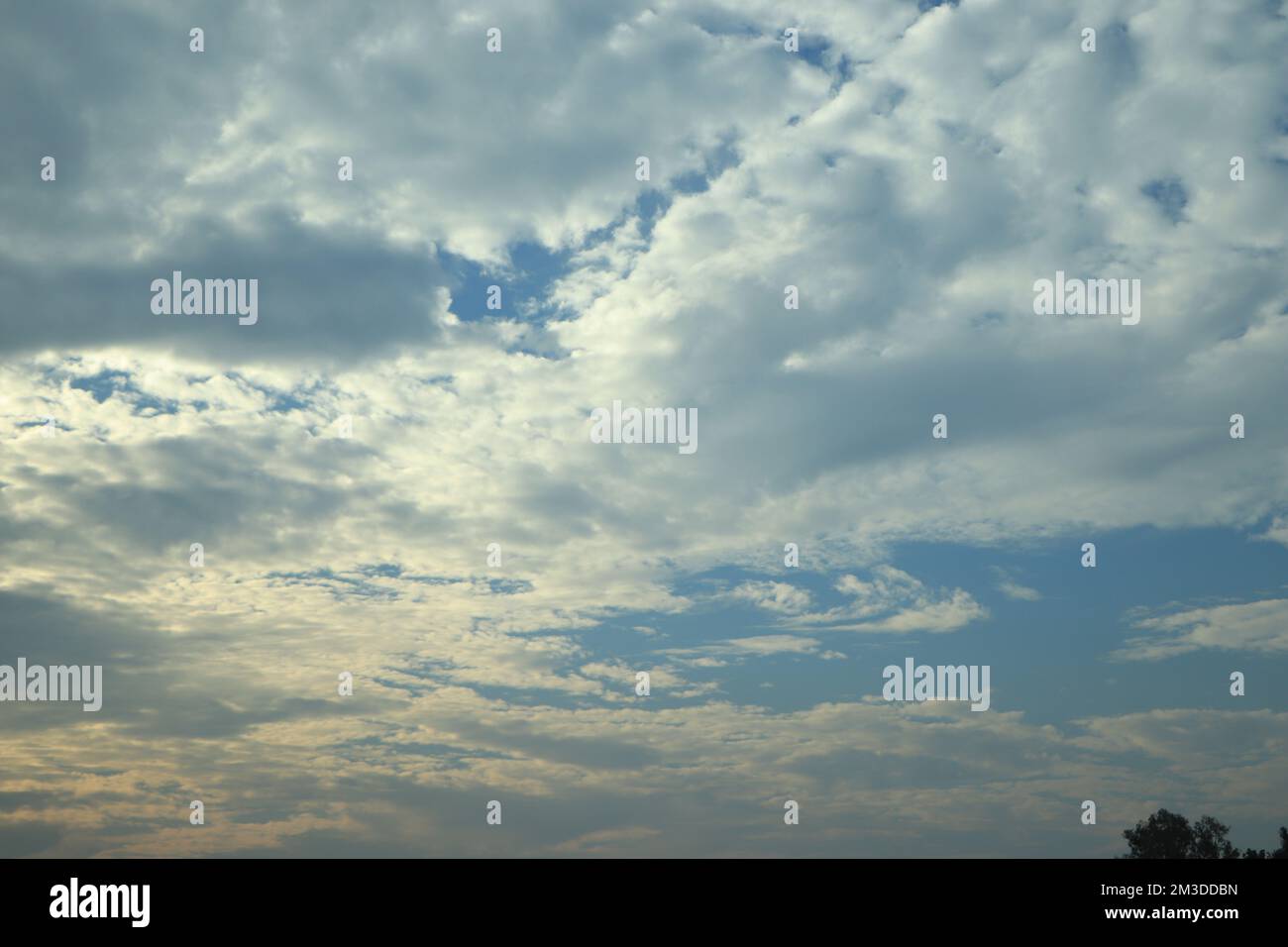 blue sky background with tiny clouds Stock Photo