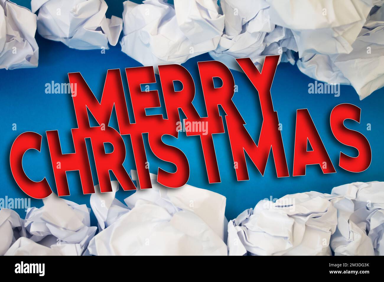 Merry Christmas text with Torn, Crumpled White Paper on colored background. Stock Photo