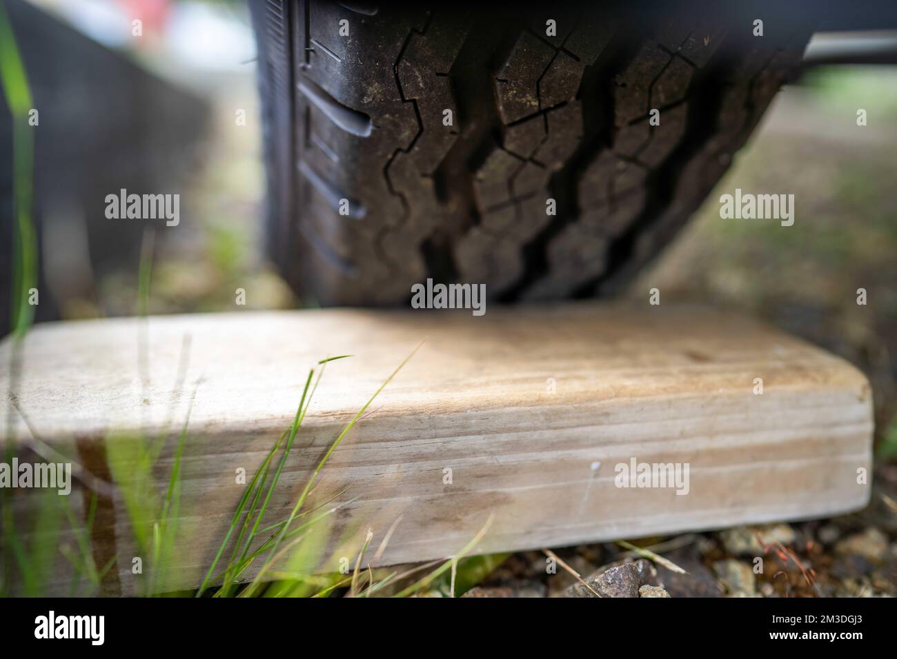 wood chocks for a caravan and camping. chocks behind a tyre. camping