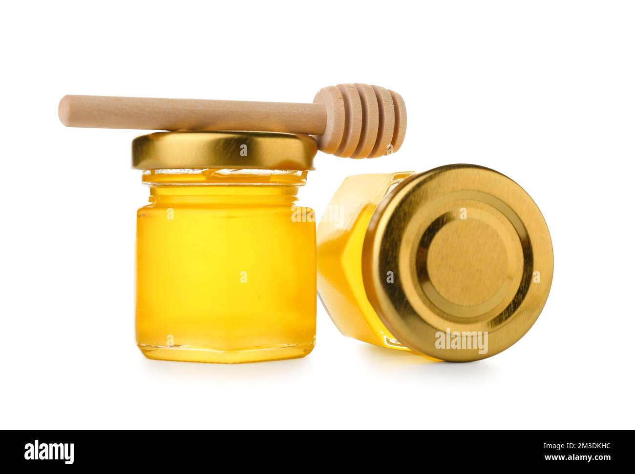 Dipper and jars with fresh honey on white background Stock Photo - Alamy